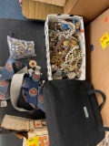 Box of jewelry, US Marine Corps suspenders, purses, movies and books
