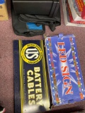 United States Rubber Company battery cable sign, LED sign, file box and duffel bags