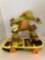 Teenage Mutant Ninja Turtle agro-rilla figure on skateboard battery operated