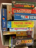 Box of board games and puzzles all in new sealed condition