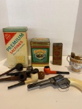 old advertising tins, pipes, shaving items, cap gun