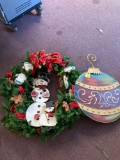 Large snowman wreath and large metal Christmas bulb