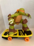 Teenage Mutant Ninja Turtle agro-rilla figure on skateboard battery operated