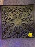 Wall decor that looks like a metal grate cover, heavy