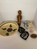 pottery bowl, doll, piggy bank, iron trivets, etc.