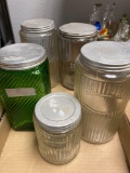 5 kitchen canisters, 4 clear, 1 green