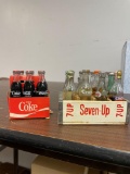 12 mini glass soda bottles in 7-Up crate, 6 Coca-Cola bottles and carrier
