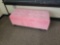 Pink upholstered lift top bench