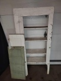 White painted shelf with extra cabinet doors