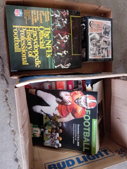 2 boxes books on football