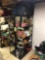 Two metal shelves, Coke bottles, baskets, luggage, cast-iron skillet Damaged