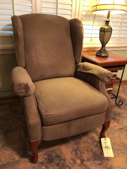 Upholstered reclining armchair
