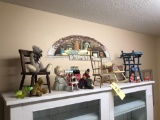 Miniature chairs, Coke bottles, bears, items on top of white cabinet