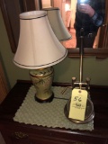Lamp, print, magnifying glass on stand