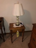 Small single drawer turned leg lamp table with lamp an alarm clock