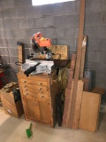 Chicago 10 inch compound miter saw on cabinet with scrap wood