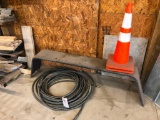 Water hose, cones, trailer fender
