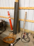 Bolt cutters, extension cord, Bottle jack, traffic cone, iron