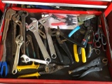 Drawer full of snips, pliers, wrenches, etc