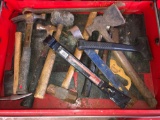 Drawer full of hammers, pry bars, mallets