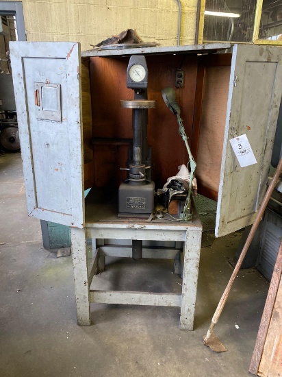 Rockwell hardness tester with cabinet