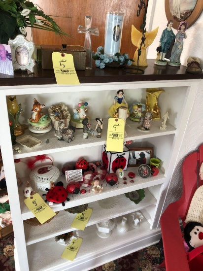 Shelf of ceramic figurines and pieces