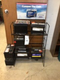 Seven stock room batteries with rack.