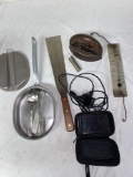 Garmin Navi GPS, US meal mess kit, spatula, glass thermometer, sad iron.