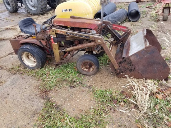 Old wheelhorse tractor with loader and rear weight, not running