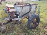 Early orchard sprayer wagon with wooden tank