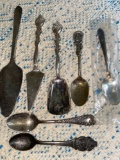 (7) Souvenir & serving spoons.