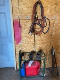 jumper cables, cord, garden shelf and fuel can