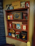 Wall shelf with assorted tobacco tins
