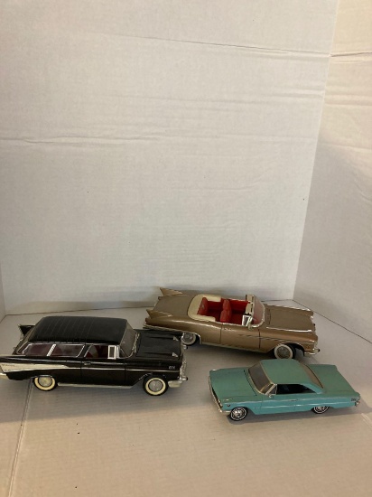 one promo kit car and two diecast cars