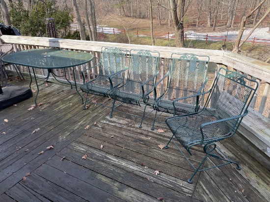 Wrought iron patio table with four chairs