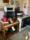 microwave, stand, stove, knives, pots pans, misc. wall decor