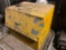 yellow steel tool cabinet, rope packing, lubricants, and sandpaper