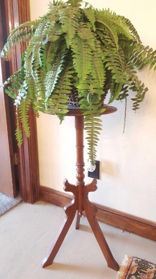 Antique plant stand with basket and faux fern