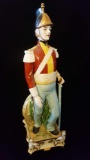 Signed porcelain military man with sword figurine