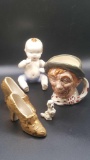 Figurine lot: baby, shoes, poodle and Royal Doulton toby