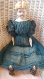 Antique blonde china head doll in old dress