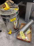 Beekeeper's stainless steel honey extractor drum.