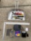 Polaroid camera, pens, dust pan, tools.