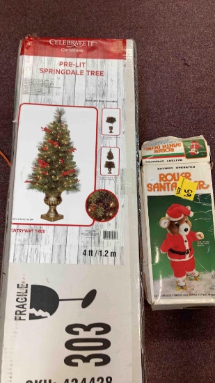roller skating teddy bear Santa and pre-lit Christmas tree