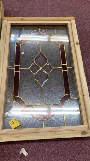 leaded and stained glass in wooden frame
