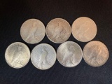 (7) Peace silver dollars. Bid times seven.