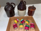 (2) Small stoneware jugs, jar w/ lid, (8) spinning tops.