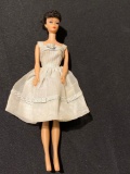 1958 (Roman numeral) Barbie doll brunette.