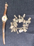 1971 Bobbs Merrill Orohan Annie watch, Oriental theme charm bracelet.
