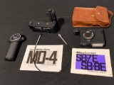 Nikon MD-4 motor drive, SB-8E speed light, camera handle.